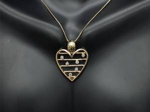lot 45 image: Diamond Heart Estate Pendant in Yellow Gold $1499 Retail
