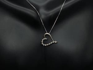 lot 47 image: Diamond Heart Pendant in White Gold $1125 Retail