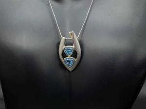 lot 51 image: Triangle Cut Blue Topaz Estate Pendant in Burnished Sterling Silver