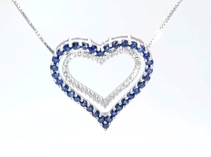 lot 26 image: Natural Blue Sapphire and Diamond Heart Estate Pendant in White Gold $2150 Retail