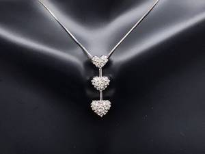 lot 39 image: Three Heart Diamond Estate Pendant in White Gold $1100 Retail
