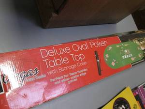 lot 66 image: Deluxe Roll-Up Oval Poker Table Top...