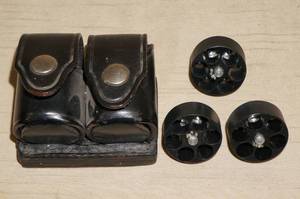 lot 43 image: 3 Revolver Speed Loaders with Leather Belt Holder