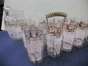 lot 19 image: Vintage Anchor Hocking Pitcher, 8 Glasses, and Holder - AmishFarmerHorse and Buggy - Gold and White - Looks New But its Old