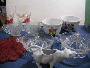 lot 86 image: 2 Clear Reamer Juicers, 2 Cereal Bowls - Fun, Cow Creamer, 2 Pig Out Glasses, Iris Glass Creamer and Sugar, Doily