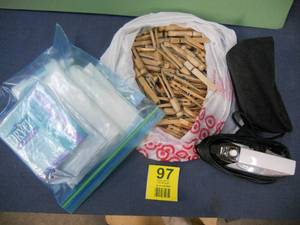 lot 97 image: Travel size iron, lots of clothespins, Dryel Home Dry-Cleaning Kit