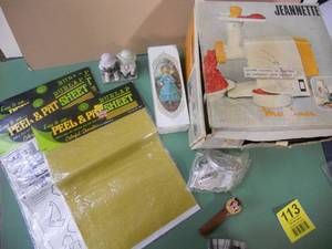 lot 113 image: Vintage Orange Meat Grinder, Cool MCM Peel & Pat Burlap Sheets in packages, Avon Perfume Full New in Box, Taz Pez dispenser, Girls Figurines