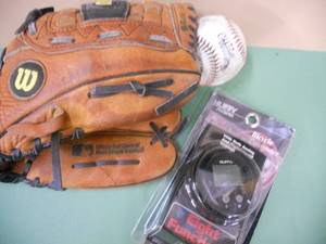 lot 140 image: Wilson Baseball Mitt, Baseball, Bike Computer Speedometer plus
