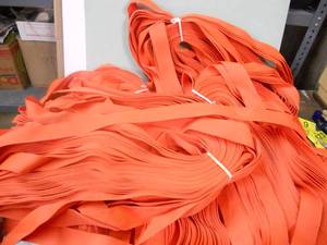 lot 115 image: Huge Lot Orange Strapping 220-230 Pieces,55-60 per bundle, 4 bundles approx 56 long
