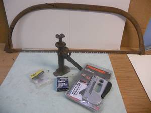 lot 156 image: Powershot nailgunstapler New in Package, Jack, hardware, and Rusty Old Saw