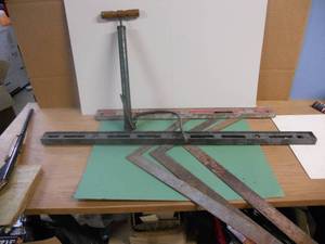 lot 166 image: Man Cave Items Antique Hand Pump, Squares, and Levels