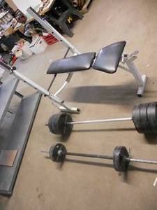 lot 168 image: Weight Bench with all the weights and bars shown