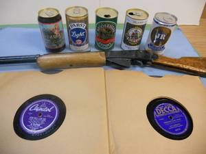 lot 172 image: Antique Beer Cans (Stergis and JR are full), Pellet Gun, and Thick Record Albums