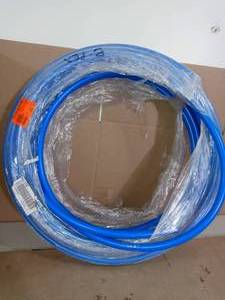 lot 71 image: 34 in. x 100 ft. Coil Blue PEX Pipe by SharkBite - not used
