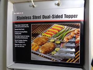 lot 52 image: Display with 24 Stainless Steel BBQ Grill Topper