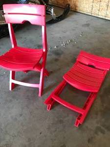 lot 21 image: (2) Foldable Plastic Red Chairs