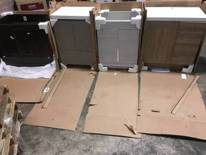 lot 22 image: Pallet with assorted Vanity Cabinets see pictures