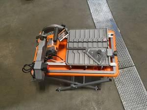 lot 42 image: Ridgid 9 Amp Corded 7 in. Wet Tile Saw with Stand open box