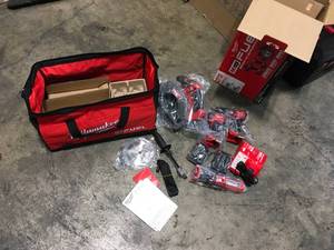 lot 12 image: Milwaukee 2998-24 M18 Fuel 4pc Combo Kit not used see pictures
