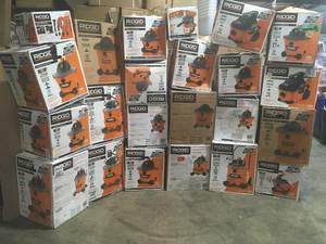 lot 24 image: Pallet with assorted Ridgid Shop Vacs open boxes customer returns see pictures