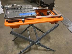 lot 46 image: Ridgid 9 Amp Corded 7 in. Wet Tile Saw with Stand see pictures