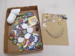 Pogs, jacket pins, tiara