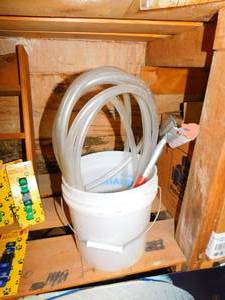 lot 182 image: Bucket with Hose and Washer with Handle