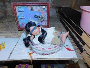 lot 20 image: Collectible Indian Doll  La Palina Cigar Box  Live, Love, Laugh Framed Picture  Indian Drum with Feathers