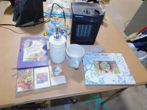 lot 94 image: Pelonis Space Heater, The Language of Flowers Book, Sketch Book, Soap Dispenser, Wrap, Coffee Cup and 3 Cassettes