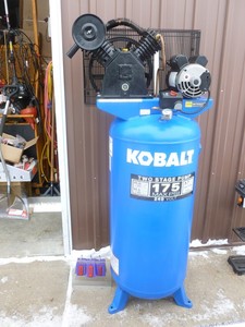 lot 1 image: Kobalt 60 gallon 2 stage 240 volt air compressor. Just pulled from shop. Good working condition. Approximately 2 years of use. Tested & works. As shown.