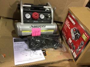 lot 49 image: 1 Gal. Portable Electric-Powered Silent Air Compressor by Husky in good condition 