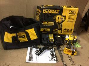 lot 90 image: ATOMIC 20-Volt MAX Lithium-Ion Brushless Cordless Compact 14 in. Impact Driver with 2 Batteries 1.3 Ah Charger and Bag by DEWALT in good condition 