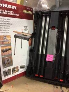 lot 92 image: 1.8 ft. x 3 ft. Portable Jobsite Workbench by Husky in good condition 