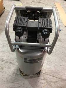 lot 107 image: 20 Gal. Vertical Electric-Powered Silent Air Compressor by Husky in working conditions