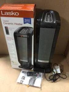lot 12 image: Tower 22 in. Electric Ceramic Oscillating Space Heater with Digital Display and Remote Control by Lasko in good condition 