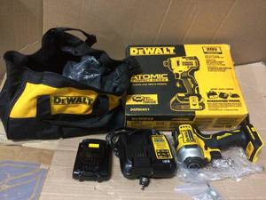 lot 17 image: ATOMIC 20-Volt MAX Lithium-Ion Brushless Cordless Compact 14 in. Impact Driver w (1) Battery 1.3Ah, Charger & Tool Bag by DEWALT in good condition 