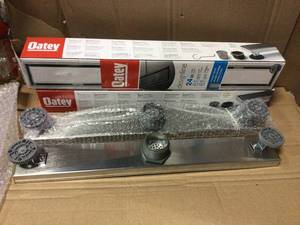 lot 34 image: Designline 24 in. Stainless Steel Linear Shower Drain with Tile-In Pattern Drain Cover by Oatey in good condition