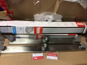 lot 64 image: Designline 36 in. Stainless Steel Linear Shower Drain with Square Pattern Drain Cover by Oatey in good condition