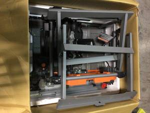 lot 106 image: RIDGID 15 Amp 10 in Table Saw with Folding Stand Not costumer returns 
