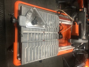 lot 116 image: RIDGID 9 Amp Corded 7 in. Wet Tile Saw with Stand In good condition