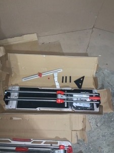 lot 40 image: 2 RUBI 26 in. Star Max Tile Cutter & 1 RUBI 28 in. Speed-N Tile Cutters not used see pics