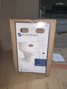 lot 44 image: Glacier bay 2-piece 1.1 GPF1.6 GPF Dual Flush Round Toilet in White complete and not used see pics