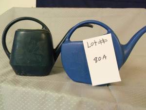 2 little water cans 1 with butterfl...