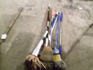Lot of 10 mix of brooms and mops...