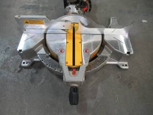 lot 9 image: Dewalt 12 in. 15 Amp Compound Double Bevel Miter Saw DWS716