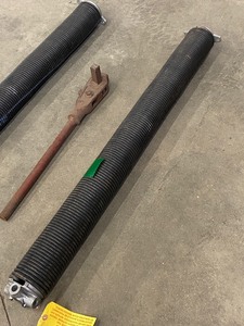 lot 4 image: (2) Garage Door Springs & (1) Ratchet Tool