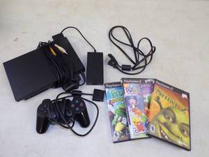 lot 15 image: Playstation 2 with 3 games