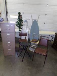 lot 48 image: File Cabinet and Chair,  2 Cosco Step Stools 2 Ironing Boards, Black Stool, Lodge Cast Iron Fry Pan and Christmas tree