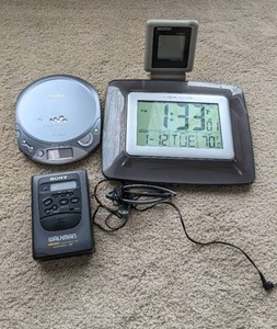 lot 306 image: Assorted Walkmans, Headphones, Atomic Clock & Digital Thermometer