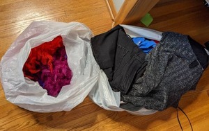lot 228 image: Two Bags Filled w Ladies Clothing and Feather Boas